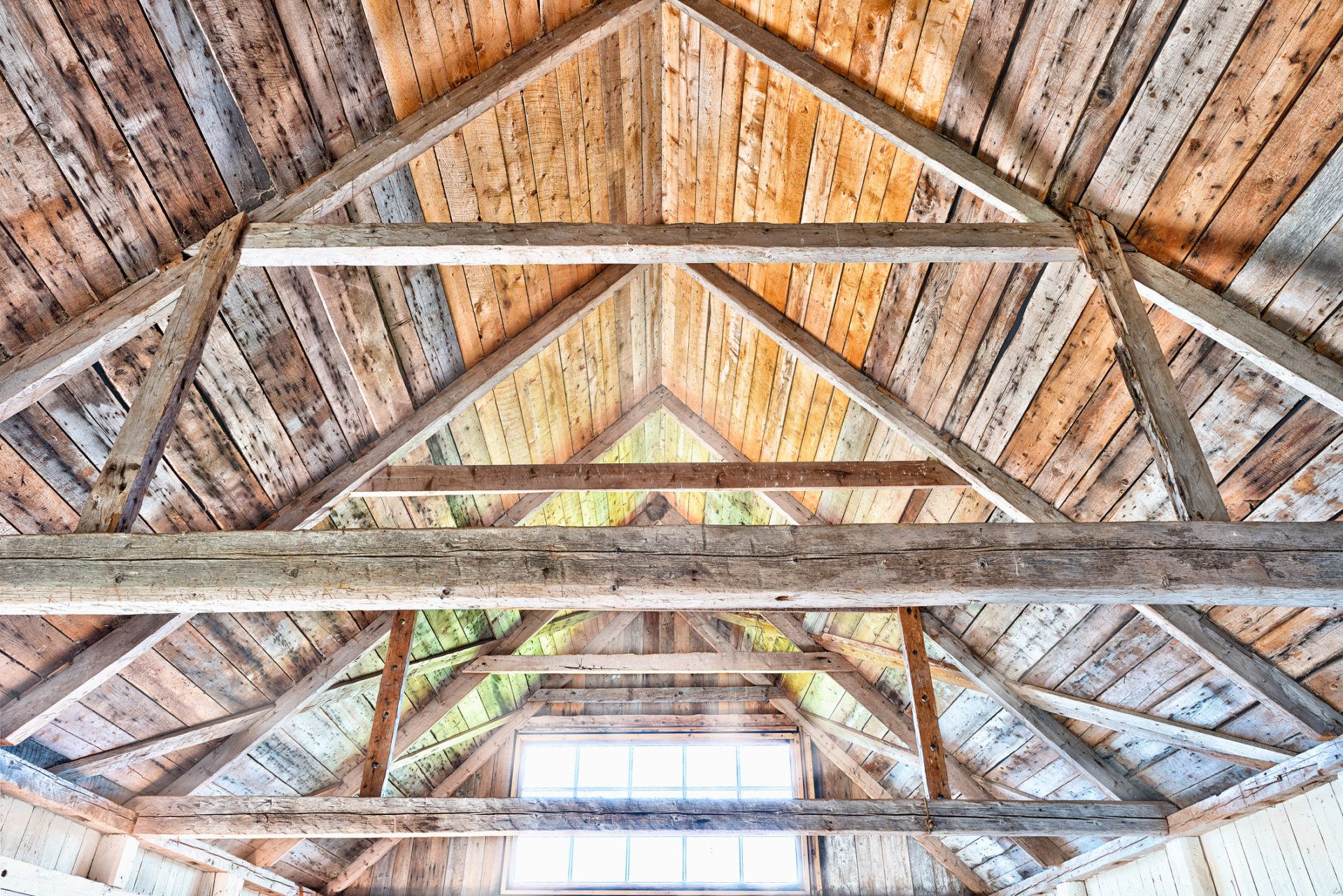 Vibrant colorful wooden interior of old, abandoned house with window, sunlight sun rays during day Vibrant colorful wooden interior of old, abandoned house with window, sunlight sun rays during day